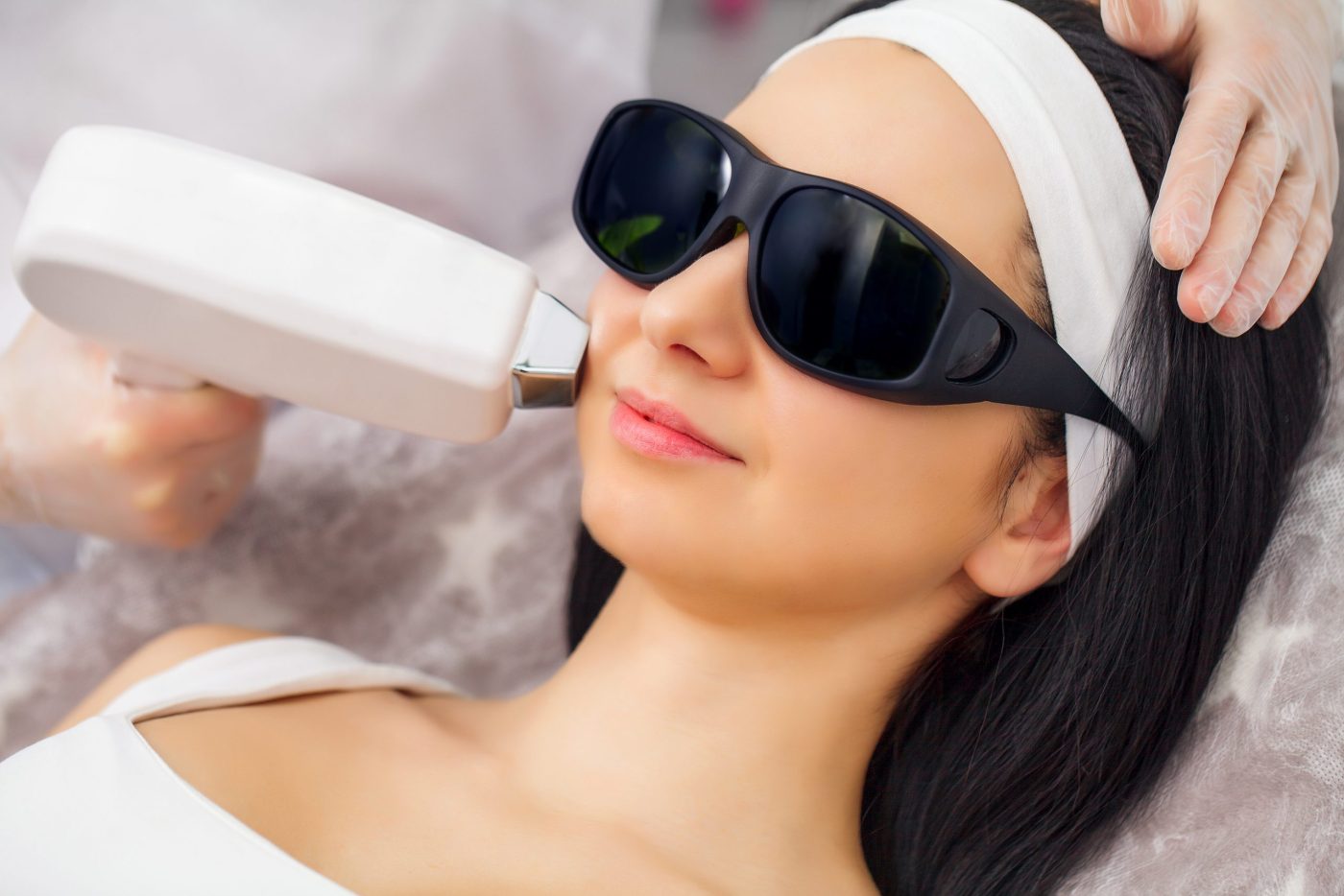 beautiful woman receiving laser hair removal procedure scaled e1655954538434